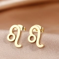 Macro shot of gold-plated Leo zodiac sign stud earrings on elegant champagne silk fabric - Gold Leo (F1205-Leo)