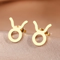 Polished gold Taurus zodiac stud earrings on textured satin, detailed jewelry macro view - Gold Taurus (F1205-Taurus)