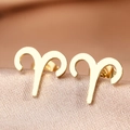 Macro shot of gold Aries zodiac sign stud earrings on elegant silk background - Gold Aries (F1205-Aries)