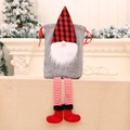 Christmas gnome gift bag with red plaid hat and long legs in a festive holiday setting - Grey