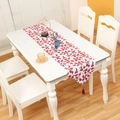 Christmas table runner with red holly leaf print and festive tassels on white base - Red Leaves Style
