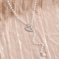Collana di perle a Y con ciondolo a cuore traforato argento su velluto champagne - Stile Cuore Cavo Argentato (F2254)
