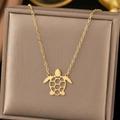 Gold stainless steel necklace featuring a minimalist hollow turtle pendant on a delicate chain - C7009