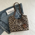 Large capacity vintage leopard print tote bag with brown straps on a denim jacket - Leopard Print