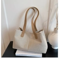 Detail of linen canvas tote bag with contrast brown straps on a minimalist setup - Beige and Khaki (without Charm)