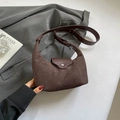 Minimalist dark brown suede half-moon crossbody bag with leather strap and metal buckle - Brown