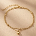 Elegant gold double-layer anklet with small beads and a water drop pendant on sand - Gold (F2241)