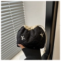 Close-up of quilted black drawstring makeup bag with sparkling silver bow details - Black With Rhinestone Bow Decor / Black