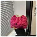 Detailed shot of pink quilted drawstring makeup bag with black K letter embroidery - Rose Pink