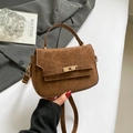 Brown vintage handbag with leopard print and gold clasp held in a stylish setting - Brown