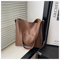 Minimalist brown vintage faux leather bucket bag with wide strap and front pocket - Tan