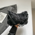 Detail of 3D rose flower mesh handbag with sleek black handles and textured floral finish - Black