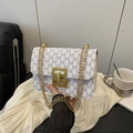 White and grey monogram shoulder bag with gold chain strap and geometric metal buckle - White
