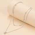 Double-layered stainless steel necklace featuring beads and a polished waterdrop pendant - Silver Teardrop Double Layer Necklace (F1582)