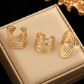 Three-piece gold geometric stainless steel ring set with hollow lines and open design - Gold Geometric 3-Piece Set (C8821)