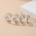 Set of four adjustable silver stainless steel rings with geometric hollow design - Silver 4-Piece Set (F2532)