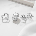 Three-piece silver ring set with heart and leaf designs on marble and silk background - Silver Heart Leaf 3-Piece Set (F1796)
