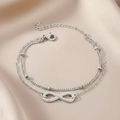 Double-layer stainless steel infinity bracelet with beads on a satin background - Silver Style (C4472)