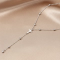 Polished stainless steel beaded cross necklace with pendant on champagne silk background - Silver (C4394)