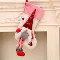 Christmas gnome stocking with pink plush trim, red striped legs, and heart patches - White