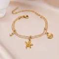 Zweireihiges goldenes Edelstahl-Armband mit Seestern, Muschel und Zirkonia Anhängern - Gold (F1317)