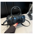 Glossy black patent leather pillow bag with round handles and gold hardware - Black
