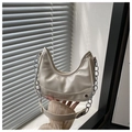 Detail of cream half-moon bag with silver metal chain and fashion embossed text - White