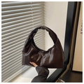 Dark brown crescent underarm bag in glossy faux leather with ruched handle design - Brown