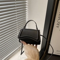 Mini black PU leather crossbody bag with curved stitching and top handle - Black