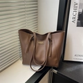 Minimalist brown leather tote bag with shoulder straps and rectangular fashion label - Brown