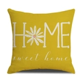 Close-up of ginger yellow linen pillowcase with white HOME sweet home text and daisy - Bright Yellow HOME Style