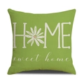 Detail of green linen pillowcase featuring HOME sweet home print and daisy floral motif - Grass Green HOME Style