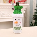 Plush snowman Christmas wine bottle cover with green stripe drawstring and Welcome text - Snowman