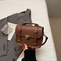 Retro brown leather handbag with vintage metal buckles and a large capacity minimalist design - Brown