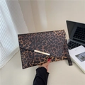 Detail of leopard print clutch bag with envelope flap and gold metal bar accent - Leopard Coffee