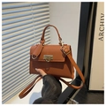 Detail of brown lychee pattern PU leather handbag with golden square twist lock - Brown