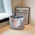 Light blue woven tote bag with gold logo lettering and metal letter M pendant - Blue