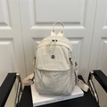 Minimalist cream white nylon backpack for daily commute featuring adjustable straps - White