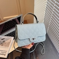 Light blue quilted leather crossbody bag with silver chain and metal turn-lock closure - Blue
