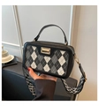 Detail of vintage plaid handbag featuring color-block diamond pattern and wide strap - Black