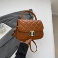 Brown quilted crossbody bag with gold shield lock and top handle in a minimalist style - Brown
