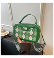 Detail of green checkered crossbody bag with stylish zigzag textured wide strap - Green