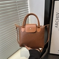 Brown woven texture tote bag with leather flap and handle for urban commuting - Brown