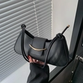 Minimalist black faux leather shoulder bag with elegant gold metal hardware detail - Black