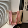 Minimalistische gewebte Stroh-Stofftasche mit rosa Trägern und Quaste für den Strand - Rosa