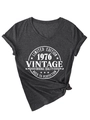 Detailed view of women's dark grey V-neck T-shirt with vintage 1976 print and knotted hem - Dark Heather Grey (White Font)