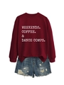 Flat lay of burgundy slogan sweatshirt paired with distressed blue denim shorts - S / Wine Red Sweatshirt (White Text)