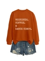 Flat lay of an orange sweatshirt with white typography print and distressed denim shorts - S / Burnt Orange Sweatshirt (White Graphic)