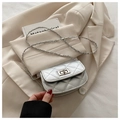 Silver quilted chain crossbody bag with metallic finish and turn-lock closure for women - Silver