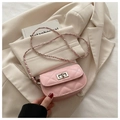 Detail of pink quilted mini crossbody bag with silver twist lock and chain strap - Pink